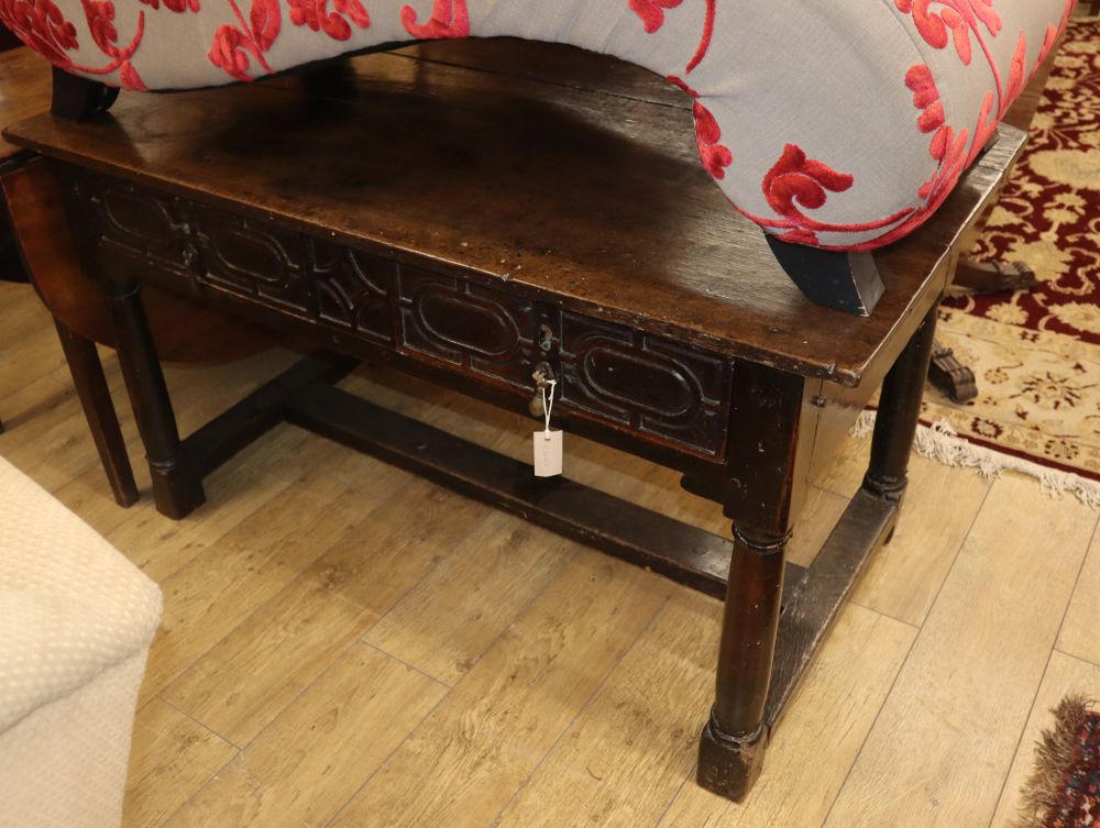 An 18th century style oak two drawer side table, W.134cm, D.73cm, H.77cm